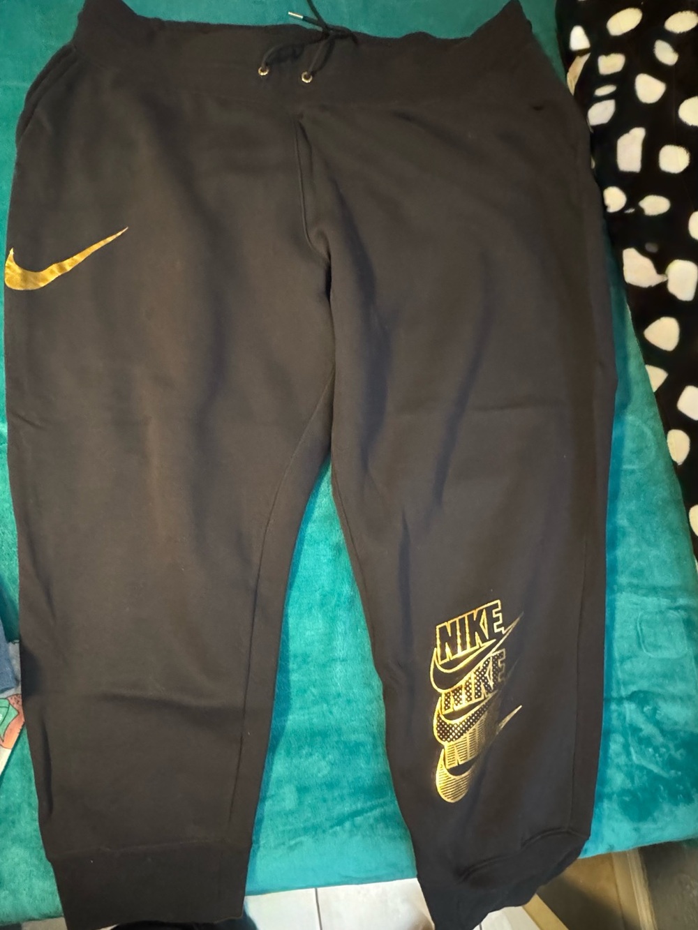 Nike Black Track Joggers with Gold Swoosh Accents